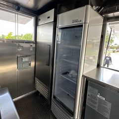 Large Black Dual-Axle Food Trailer with Expanded Multi-Section Serving Area