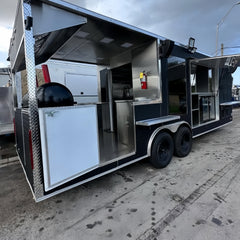 Large Black Dual-Axle Food Trailer with Expanded Multi-Section Serving Area