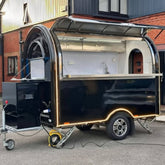Black Compact Food Trailer with Curved Roof and Serving Window for Coffee, Drinks and Desserts