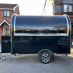 Black Compact Food Trailer with Curved Roof and Serving Window for Coffee, Drinks and Desserts
