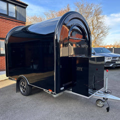 Black Compact Food Trailer with Curved Roof and Serving Window for Coffee, Drinks and Desserts