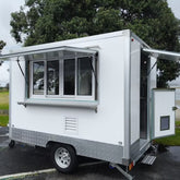 9.8ft White Enclosed Food Trailer for Mobile Catering with Single Axle & Diamond Plate Skirt