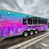 23ft Custom Wrapped Tri-Axle Enclosed Food Trailer for High-Volume Catering with Neon Skyline Design