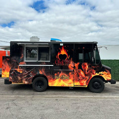 Black Food Truck with Fiery Flame Graphics & Gourmet Food Branding