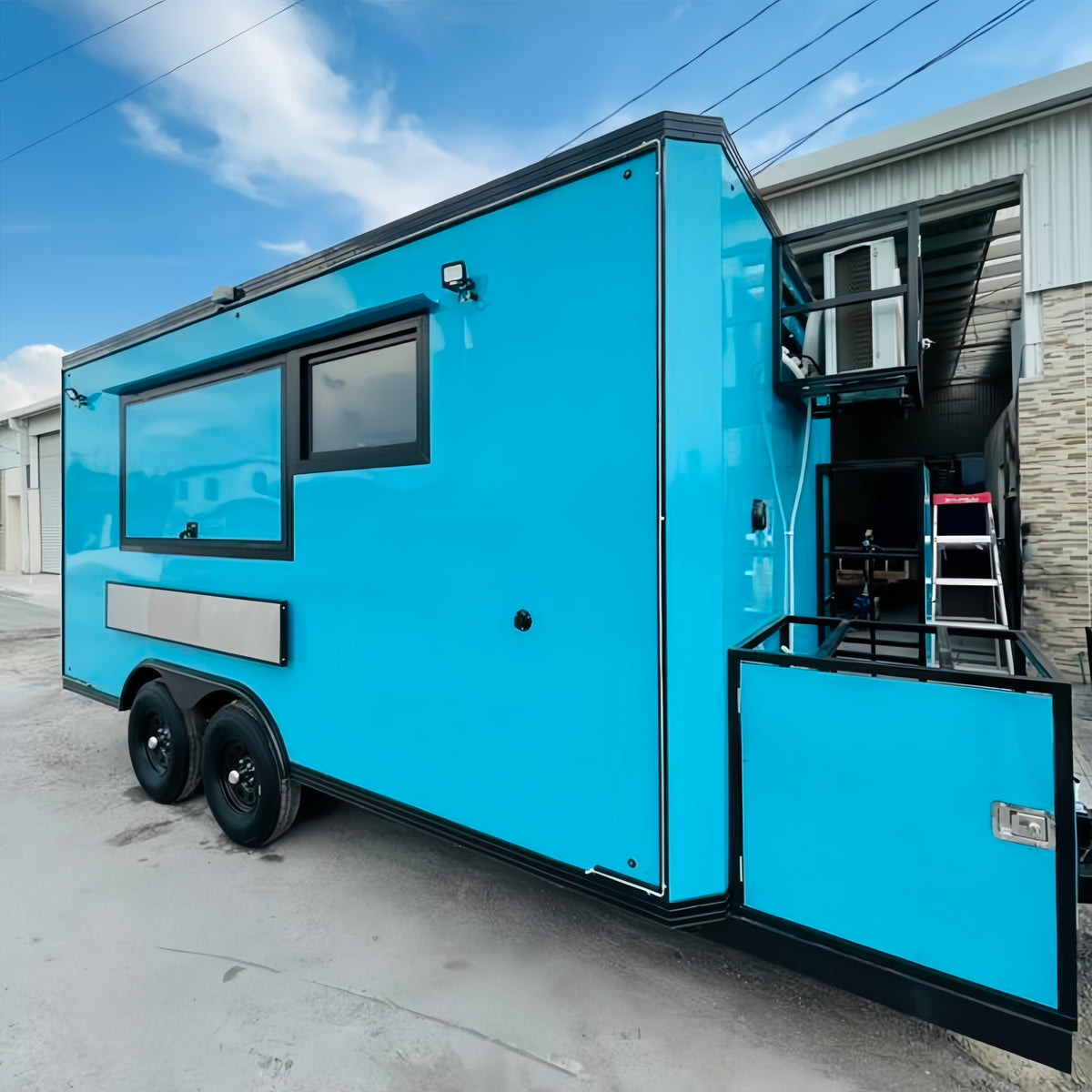 Bright blue Dual-Axle Food Trailer with Expanded Service Platform