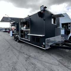Large Black Dual-Axle Food Trailer with Expanded Multi-Section Serving Area