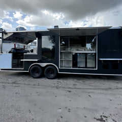 Large Black Dual-Axle Food Trailer with Expanded Multi-Section Serving Area
