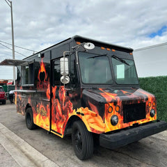 Black Food Truck with Fiery Flame Graphics & Gourmet Food Branding